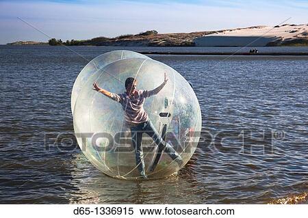 Lithuania, Western Lithuania, Curonian Spit, Nida, kids in waterball, NR View Large Photo Image Stock Photography - Lithuania, Western Lithuania, Curonian Spit, Nida, kids in waterball, NR. Fotosearch