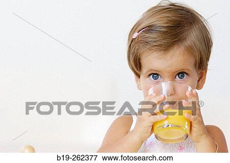 Litlle girl having a soft drink View Large Photo Image Stock Photo - Litlle girl having a soft drink. Fotosearch