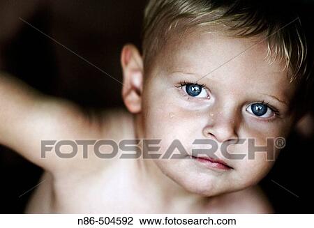 Stock Image - Little blue eyed boy. Fotosearch