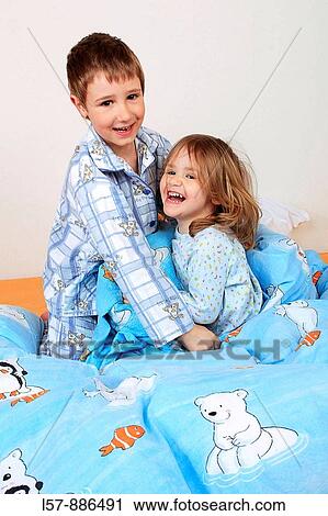 little boy and girl in bed having a pillow fight, studio, Oetwil am See, Zuerich, Switzerland View Large Photo Image Stock Image - little boy and girl in bed having a pillow fight, studio, Oetwil am See, Zuerich, Switzerland. Fotosearch