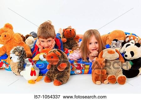 little boy and girl in bed with toy animals, studio, Oetwil am See, Zuerich, Switzerland View Large Photo Image Stock Photo - little boy and girl in bed with toy animals, studio, Oetwil am See, Zuerich, Switzerland. Fotosearch