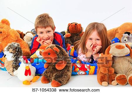 little boy and girl in bed with toy animals, studio, Oetwil am See, Zuerich, Switzerland View Large Photo Image Stock Photo - little boy and girl in bed with toy animals, studio, Oetwil am See, Zuerich, Switzerland. Fotosearch