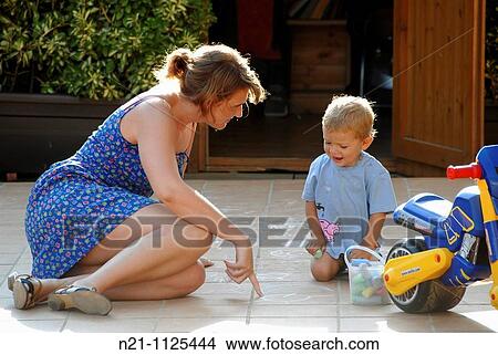 Little Boy and woman at play. View Large Photo Image Picture - Little Boy and woman at play.. Fotosearch