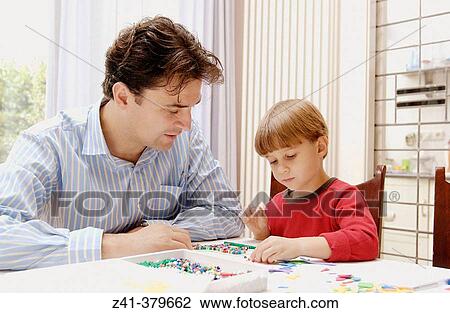 Little boy doing handicraft View Large Photo Image Stock Image - Little boy doing handicraft. Fotosearch