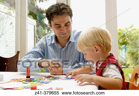 Little boy doing handicraft View Large Photo Image Stock Photography - Little boy doing handicraft. Fotosearch