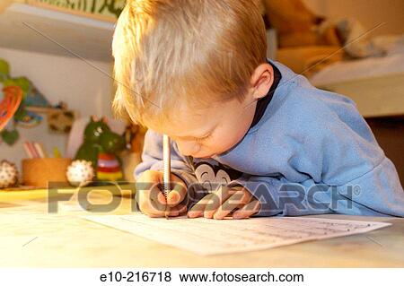 Little boy doing his homework View Large Photo Image Stock Photo - Little boy doing his homework. Fotosearch