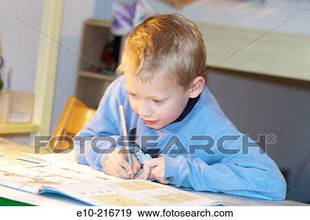 Little boy doing his homework View Large Photo Image Stock Photo - Little boy doing his homework. Fotosearch