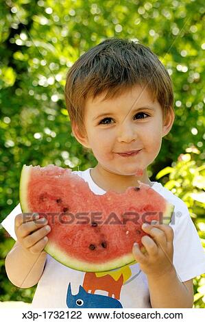 Little boy eating watermelon View Large Photo Image Stock Image - Little boy eating watermelon. Fotosearch