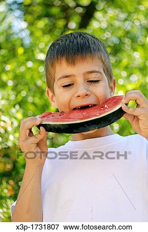 Little boy eating watermelon View Large Photo Image Stock Photo - Little boy eating watermelon. Fotosearch