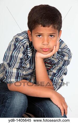 Little Boy looking at the camera posing View Large Photo Image Stock Photography - Little Boy looking at the camera posing. Fotosearch