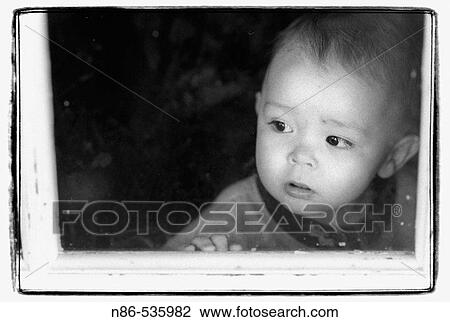Little boy looking through screen door View Large Photo Image Stock Image - Little boy looking through screen door. Fotosearch