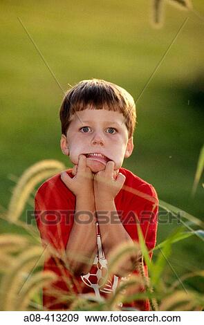 Little boy makes a funny face. USA. View Large Photo Image Stock Photo - Little boy makes a funny face. USA.. Fotosearch