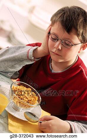 Little boy, nine years old, does not want to eat. View Large Photo Image Stock Image - Little boy, nine years old, does not want to eat.. Fotosearch