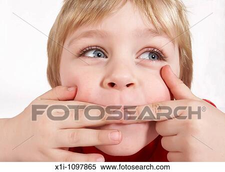 Little boy pulling a face View Large Photo Image Stock Photography - Little boy pulling a face. Fotosearch