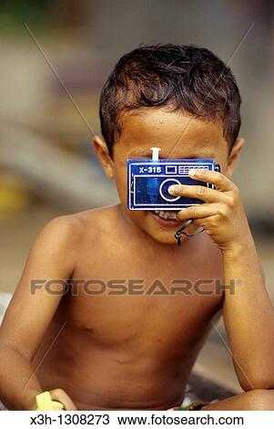 little boy with a facticious camera, Sumatra island, Republic of Indonesia, Southeast Asia and Oceania View Large Photo Image Stock Image - little boy with a facticious camera, Sumatra island, Republic of Indonesia, Southeast Asia and Oceania. Fotosearch