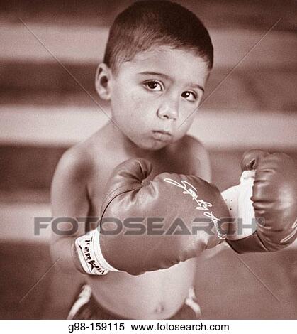 Little boy with boxing gloves View Large Photo Image Stock Photography - Little boy with boxing gloves. Fotosearch
