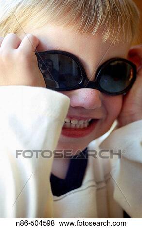 Little boy with sunglasses View Large Photo Image Stock Photo - Little boy with sunglasses. Fotosearch