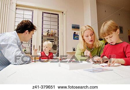 Stock Image - Little boys doing handicraft. Fotosearch