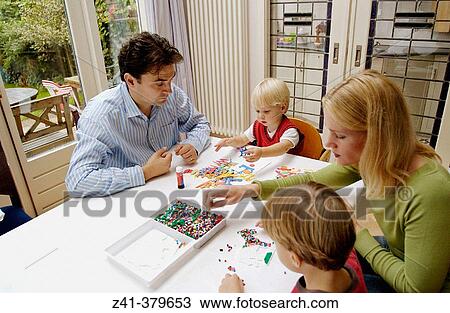 Stock Image - Little boys doing handicraft. Fotosearch