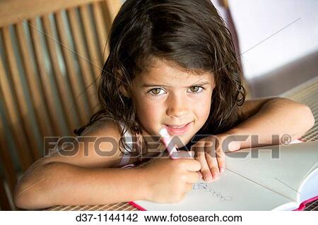 Little caucasian girl writing on a notebook View Large Photo Image Stock Image - Little caucasian girl writing on a notebook. Fotosearch