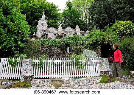 Little Chapel in St Saviours A French priest built it at the bigining of the 20 century with seashell, pebbles and colourful pieces of boken china which he received from all over the world Guernsey, Channel Islands, UK View Large Photo Image Stock Photo - Little Chapel in St Saviours A French priest built it at the bigining of the 20 century with seashell, pebbles and colourful pieces of boken china which he received from all over the world Guernsey, Channel Islands, UK. Fotosearch