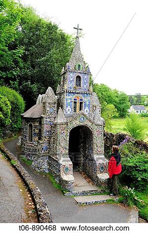Stock Photo - Little Chapel in St Saviours A French priest built it at the bigining of the 20 century with seashell, pebbles and colourful pieces of boken china which he received from all over the world Guernsey, Channel Islands, UK. Fotosearch