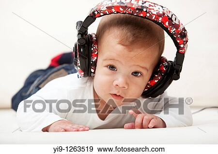 Little child with headphones View Large Photo Image Stock Photo - Little child with headphones. Fotosearch