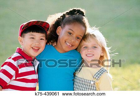 Little children hugging and smiling View Large Photo Image Stock Image - Little children hugging and smiling. Fotosearch