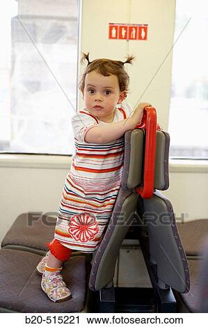 Stock Image - Little girl (2 years old) travelling in tramway.. Fotosearch