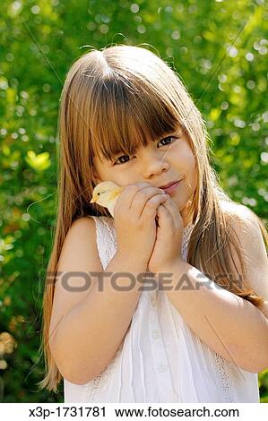 Little girl and chick View Large Photo Image Stock Image - Little girl and chick. Fotosearch