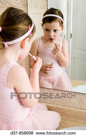 Little girl applying make up View Large Photo Image Stock Photo - Little girl applying make up. Fotosearch