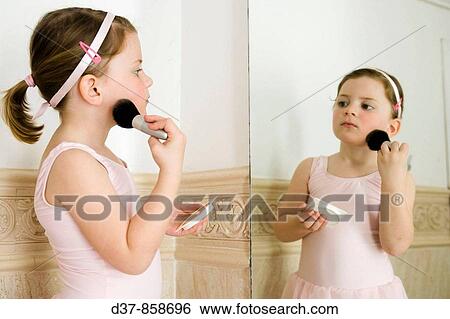 Little girl applying make up View Large Photo Image Stock Photograph - Little girl applying make up. Fotosearch