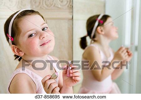 Little girl applying make up View Large Photo Image Stock Photography - Little girl applying make up. Fotosearch
