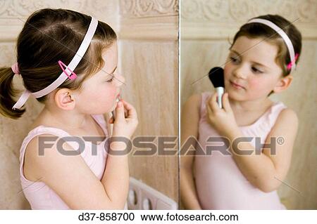 Little girl applyinhg make up View Large Photo Image Stock Image - Little girl applyinhg make up. Fotosearch