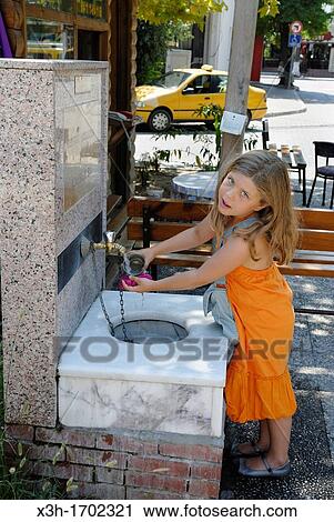 little girl at a public fountain, Fethiye, Lycian coast, Turkey, Eurasia View Large Photo Image Stock Image - little girl at a public fountain, Fethiye, Lycian coast, Turkey, Eurasia. Fotosearch