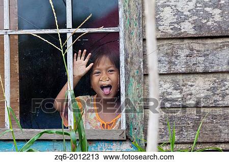 Little Girl behind a Window Glass in Banjarmasin, Indonesia. View Large Photo Image Stock Image - Little Girl behind a Window Glass in Banjarmasin, Indonesia.. Fotosearch