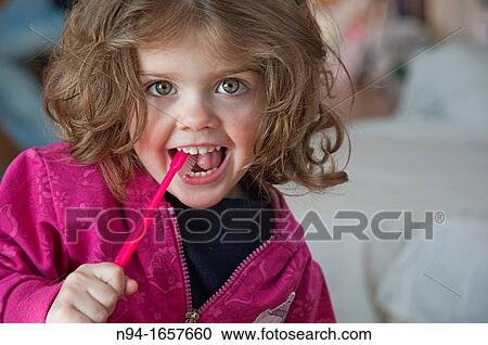 Little girl brushing her teeth View Large Photo Image Stock Image - Little girl brushing her teeth. Fotosearch