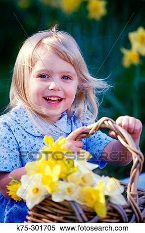 little girl carrying a basket of daffodils View Large Photo Image Stock Photography - little girl carrying a basket of daffodils. Fotosearch