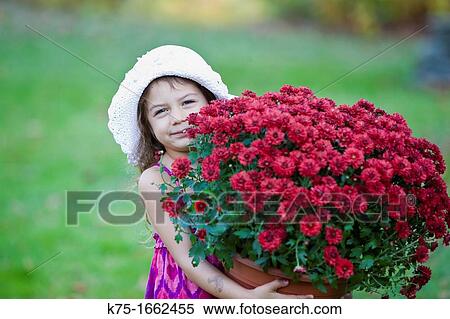 Little girl carrying large pot of flowers View Large Photo Image Stock Photography - Little girl carrying large pot of flowers. Fotosearch
