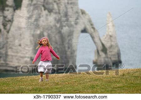 little girl dancing on the top of cliff, Etretat, Cote d? Albatre, Pays de Caux, Seine-Maritime department, Upper Normandy region, France, Europe View Large Photo Image Stock Photo - little girl dancing on the top of cliff, Etretat, Cote d? Albatre, Pays de Caux, Seine-Maritime department, Upper Normandy region, France, Europe. Fotosearch