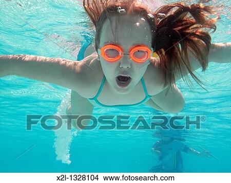 Little girl diving in the pool View Large Photo Image Picture - Little girl diving in the pool. Fotosearch