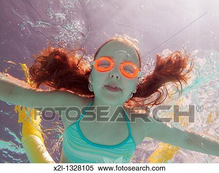 Little girl diving in the pool View Large Photo Image Stock Photography - Little girl diving in the pool. Fotosearch