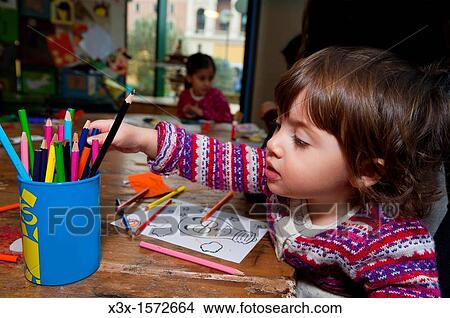 Little girl drawing View Large Photo Image Picture - Little girl drawing. Fotosearch