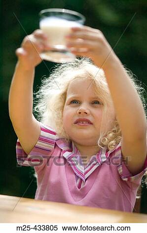 Little girl drinking glass of milk View Large Photo Image Stock Photography - Little girl drinking glass of milk. Fotosearch