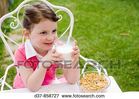 Stock Photo - Little girl drinking milk. Fotosearch