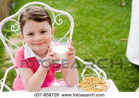Little girl drinking milk View Large Photo Image Stock Photo - Little girl drinking milk. Fotosearch