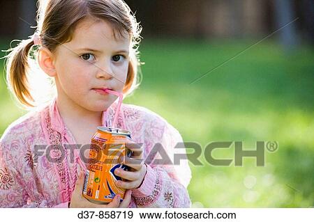 Little girl drinking soda outdoors View Large Photo Image Stock Photo - Little girl drinking soda outdoors. Fotosearch