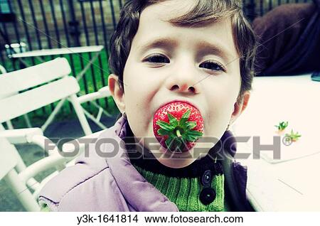 Little girl eating strawberries. London View Large Photo Image Picture - Little girl eating strawberries. London. Fotosearch