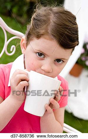 Little girl holding a mug View Large Photo Image Stock Photograph - Little girl holding a mug. Fotosearch
