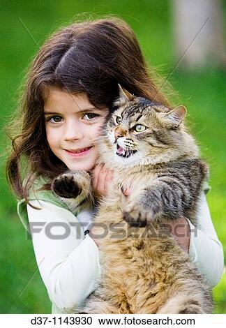 Little girl holding her cat View Large Photo Image Stock Image - Little girl holding her cat. Fotosearch